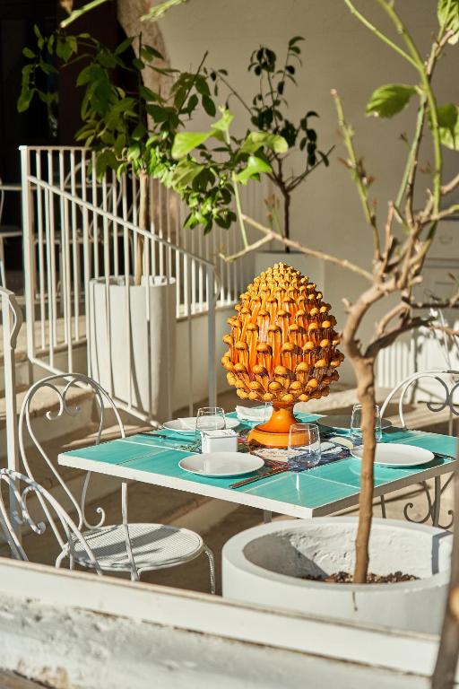 a table with a pineapple on top of it at Il Trappetello in Monopoli