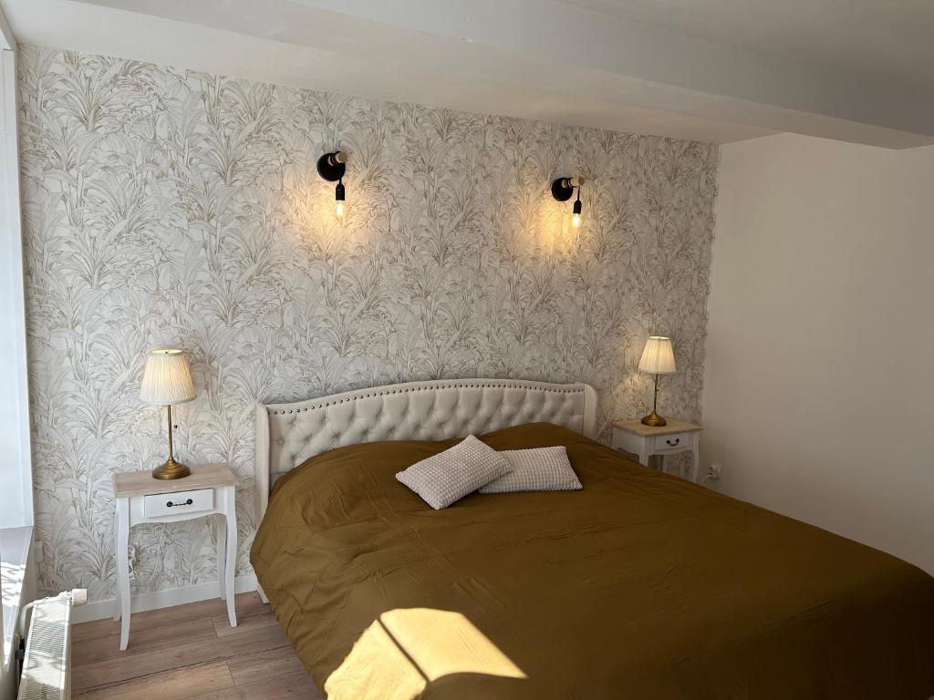 En eller flere senge i et værelse på Gite La Maison d'Amalia