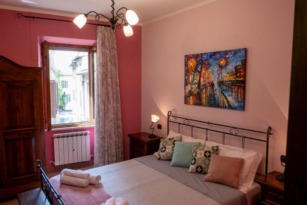 Posteľ alebo postele v izbe v ubytovaní Appartamento Talia