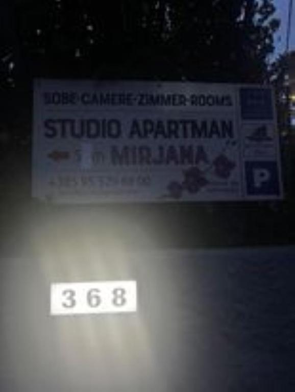 a sign for a school with a sign on it at Studio apartman"Mirjana", Podhum 368 in Podhum