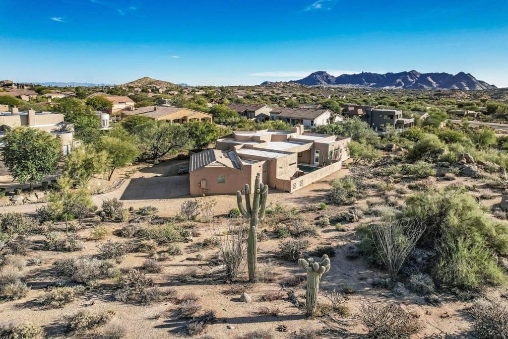an aerial view of a home in the desert at Serenity Peaks- Gorgeous Pet Friendly Villa in Scottsdale with Pool, Spa, and Bikes in Scottsdale