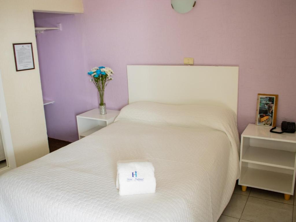 Postel nebo postele na pokoji v ubytování Hotel Imperial