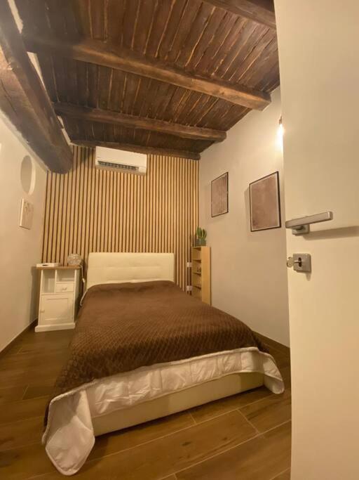 Postel nebo postele na pokoji v ubytování Una pausa dalla città