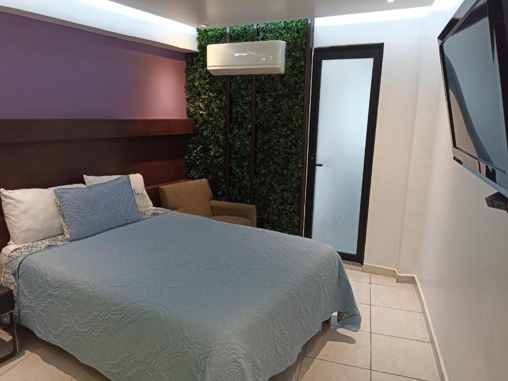 Postel nebo postele na pokoji v ubytování Hotel Imperial