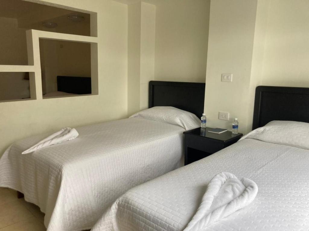 Postel nebo postele na pokoji v ubytování Hotel Imperial