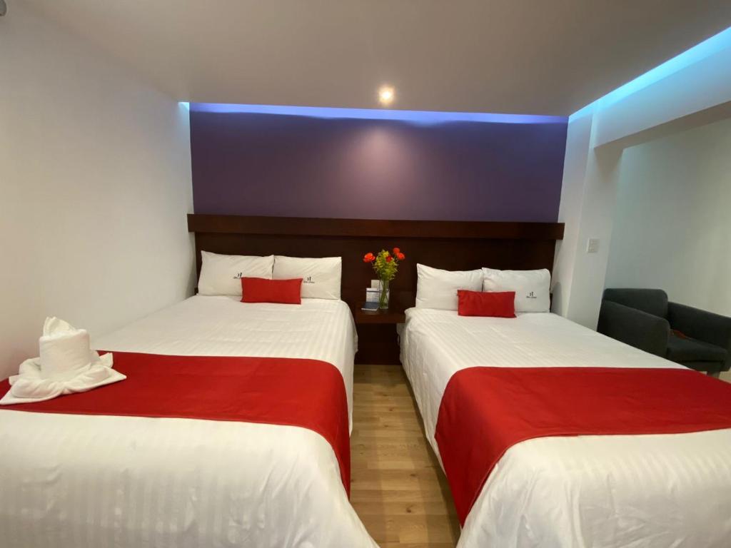 Postel nebo postele na pokoji v ubytování Hotel Imperial