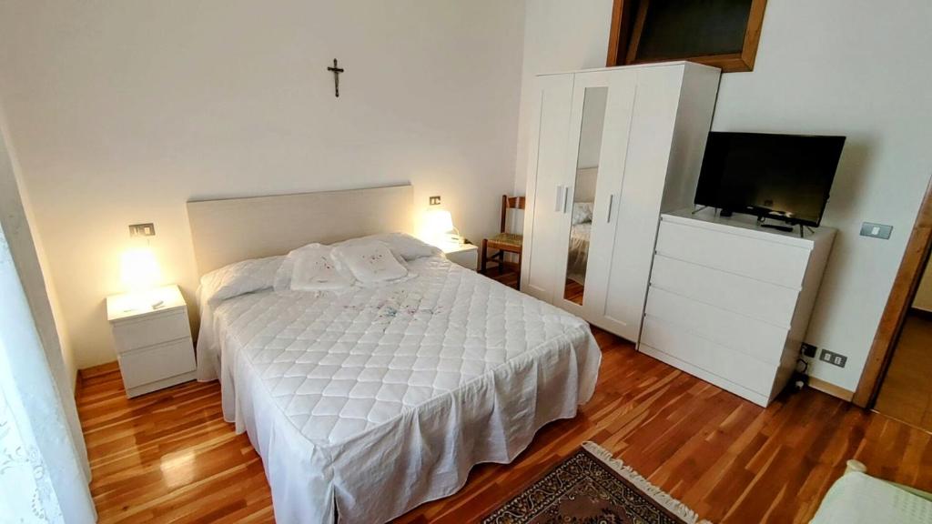 Postel nebo postele na pokoji v ubytování Casa Affitto Daone