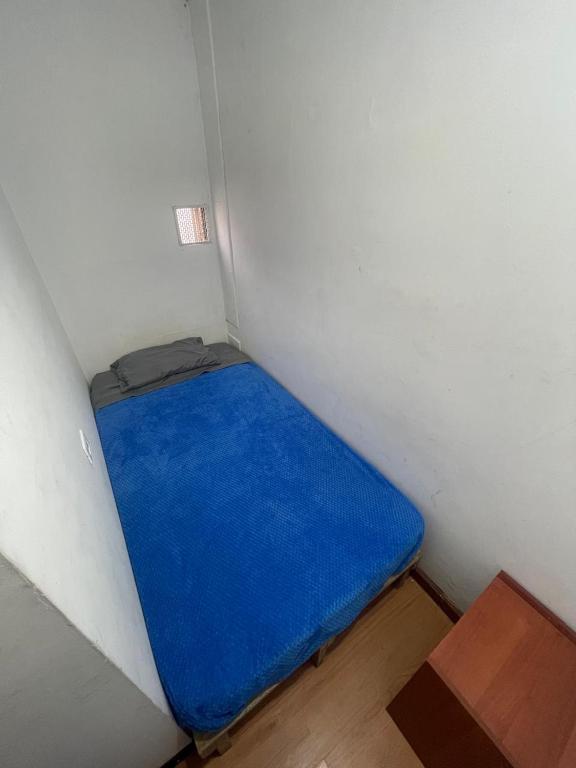 Postel nebo postele na pokoji v ubytování Hostel Bogotá Niza Tu sitio