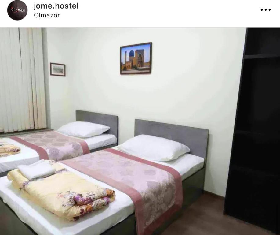 Ένα ή περισσότερα κρεβάτια σε δωμάτιο στο Jome Hostel