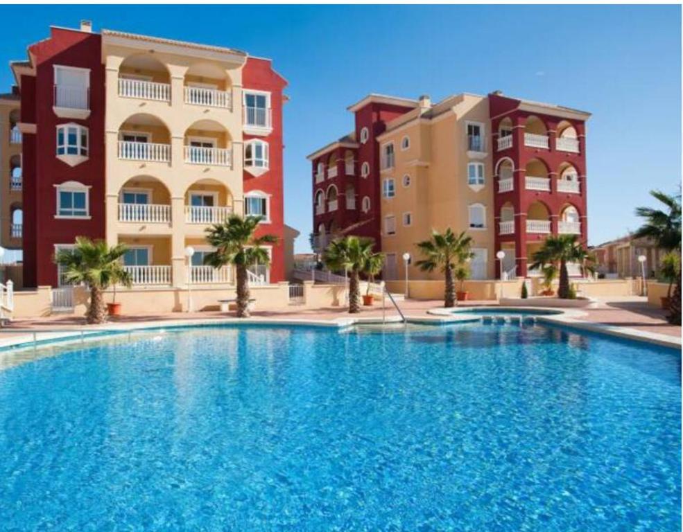 Bazén v ubytování Ground floor apartment with 3 pools nebo v jeho okolí