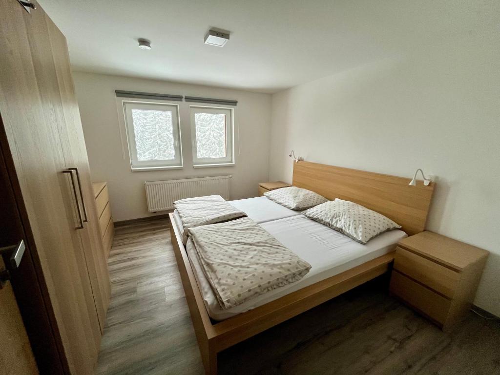 Postel nebo postele na pokoji v ubytování Pardubické boudy
