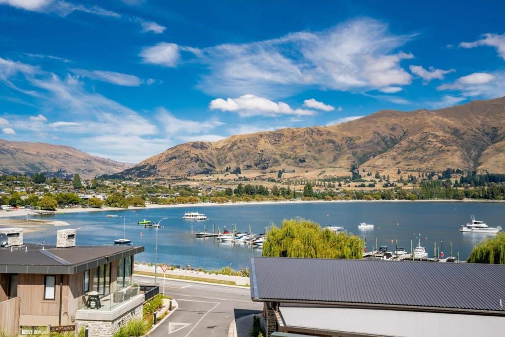 a view of a marina with boats in the water at Lake View Studio Apartment in Wanaka