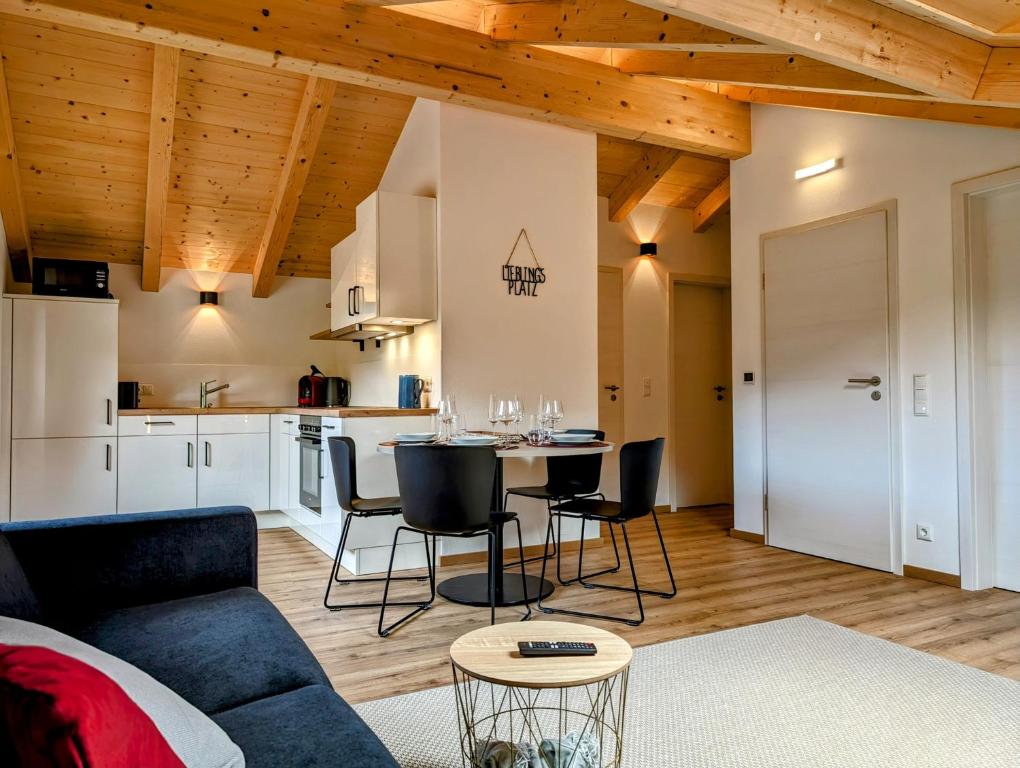 a living room with a couch and a table at Staufen-Chalet Hochreit in Anger