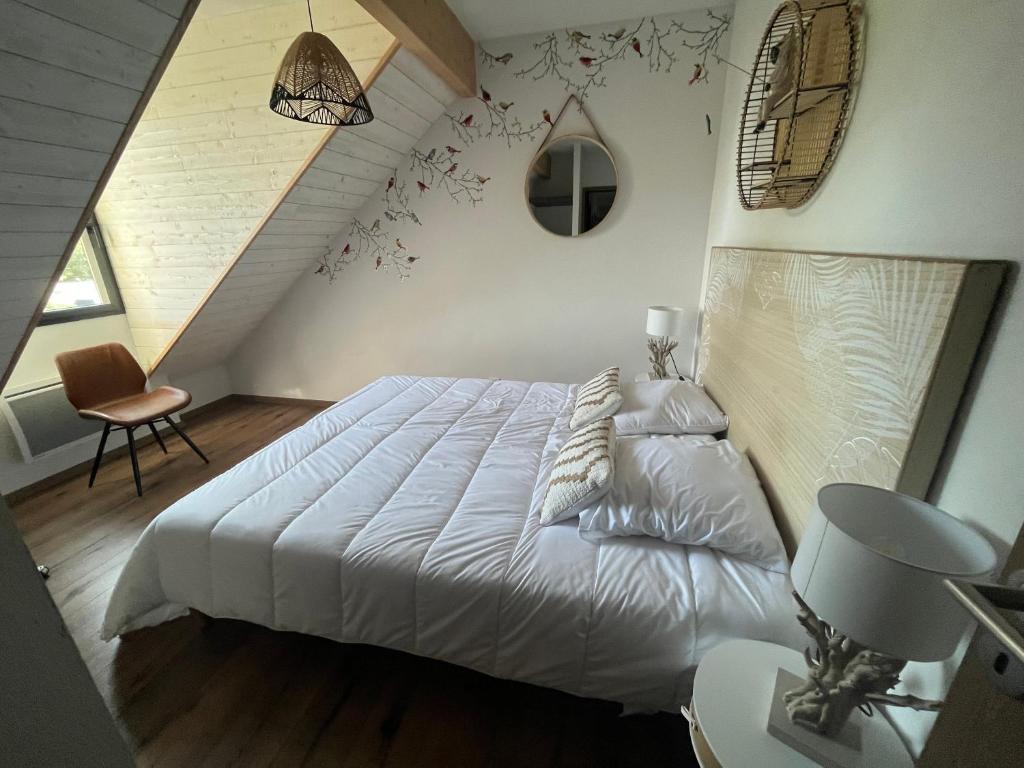 Łóżko lub łóżka w pokoju w obiekcie T4 Saint Lary