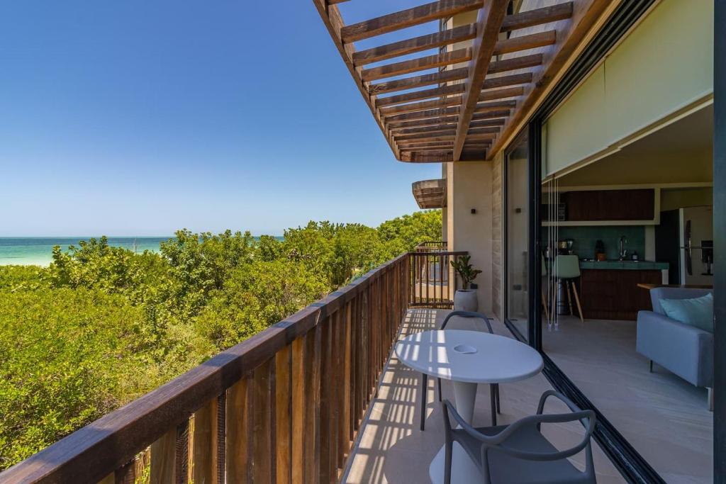 a balcony with a view of the ocean at Ocean View Loft in Punta Cocos - C102 in Holbox Island