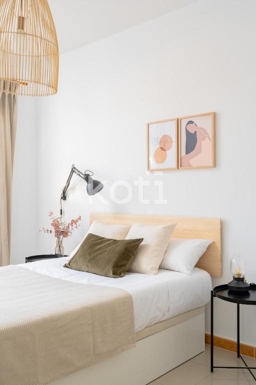 Postel nebo postele na pokoji v ubytování Koti Rentals - Nenúfar