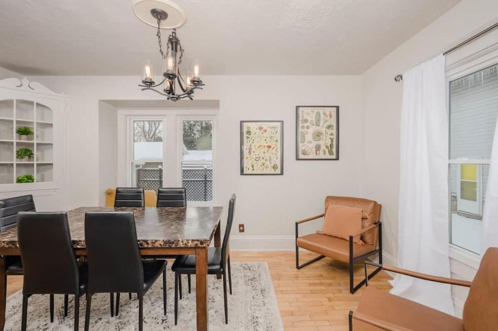 a dining room with a table and chairs at Home Away from Home off College Avenue in Appleton