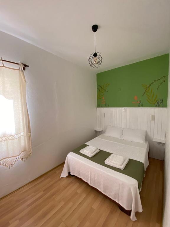 Postel nebo postele na pokoji v ubytování Yedi Butik Hotel
