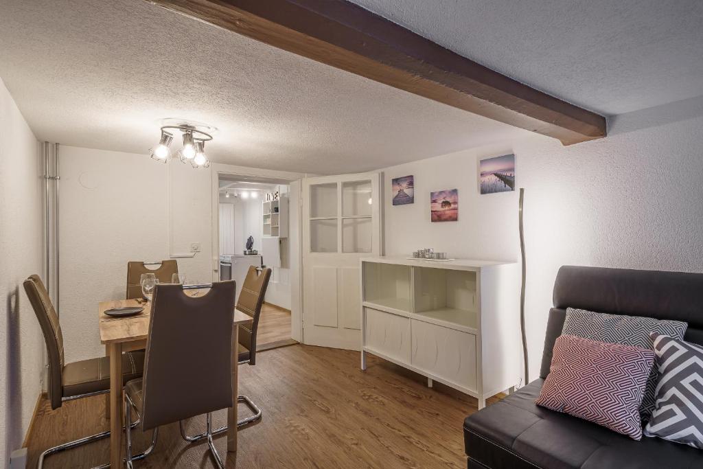a living room with a table and a dining room at Apartment am schönen Brienzersee in Brienz