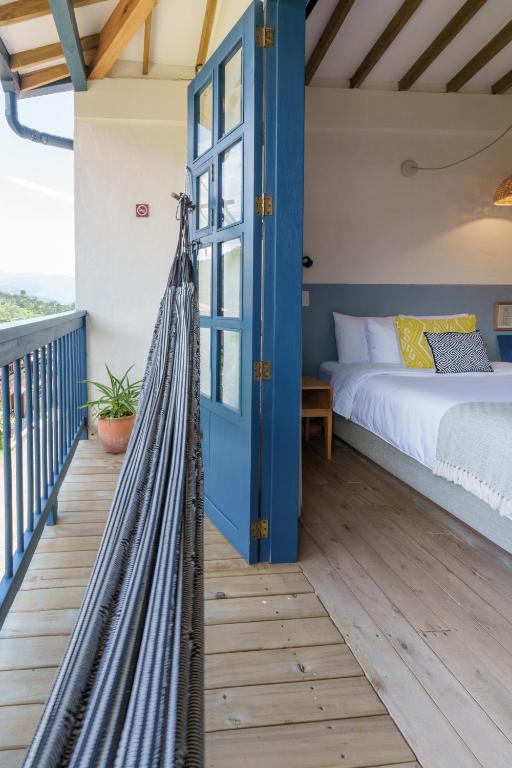 Postel nebo postele na pokoji v ubytování Hotel Plantación
