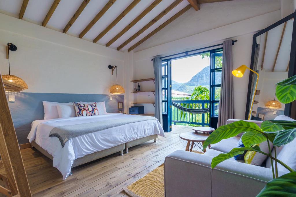 Postel nebo postele na pokoji v ubytování Hotel Plantación