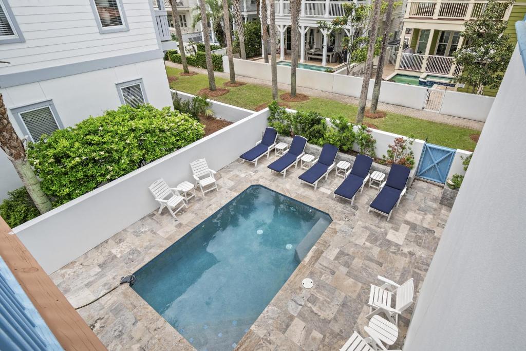 an overhead view of a swimming pool with lounge chairs and a swimming pool at My Blue Heaven in Rosemary Beach