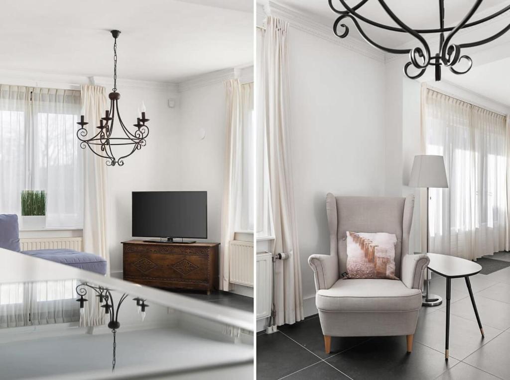 een witte woonkamer met een stoel en een tv bij Hello Zeeland - Appartement Domburgseweg 11-2 in Domburg