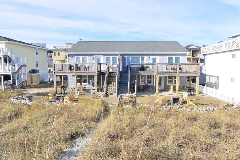 a large house on the beach with houses at Hazels Castle Huge 2 in 1 Oceanfront House near Pier in Myrtle Beach