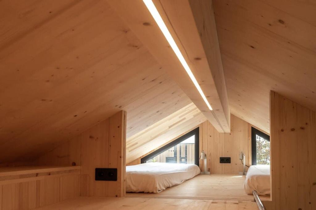 Postel nebo postele na pokoji v ubytování Hello Zeeland - Zeeuwse Liefde Tiny House 8