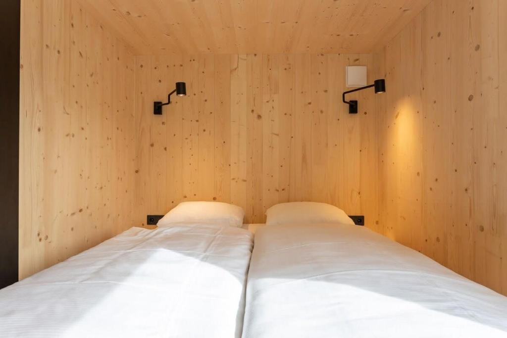 Postel nebo postele na pokoji v ubytování Hello Zeeland - Zeeuwse Liefde Tiny House 8