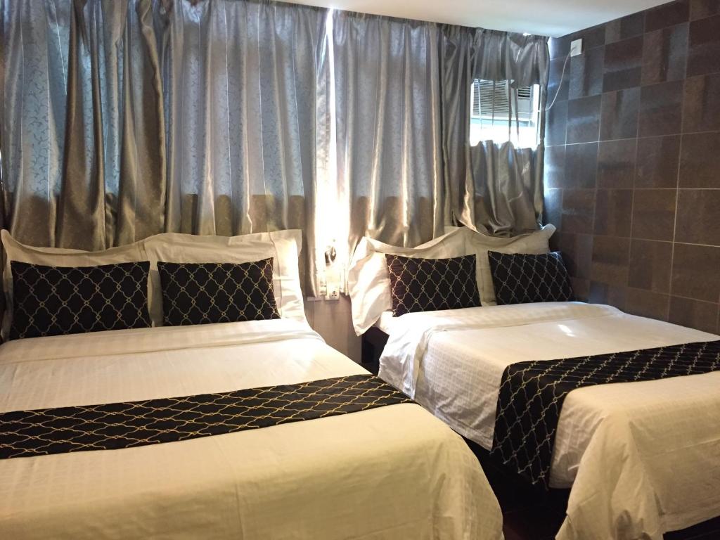 Postel nebo postele na pokoji v ubytování California Hotel