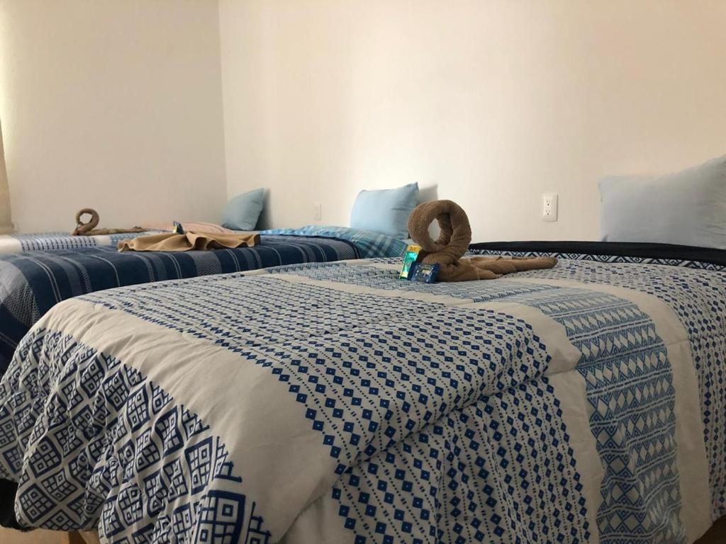 Katil atau katil-katil dalam bilik di Hotel Puerto Real