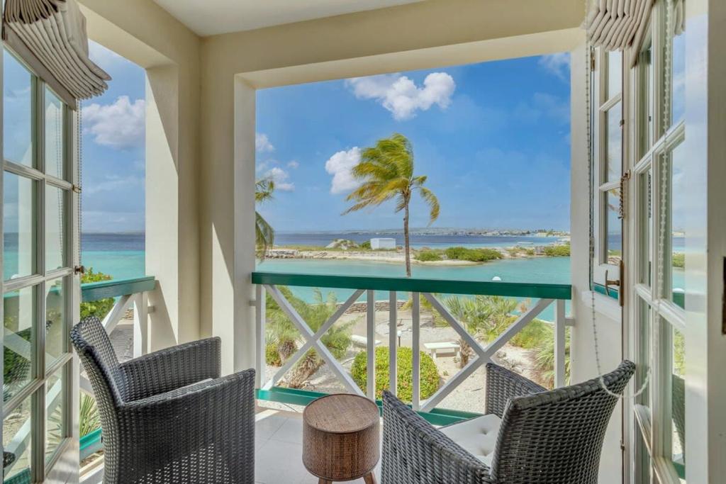 a room with a view of the beach and the ocean at Port Bonaire Seascape A301 with Sea Views and Pool in Kralendijk