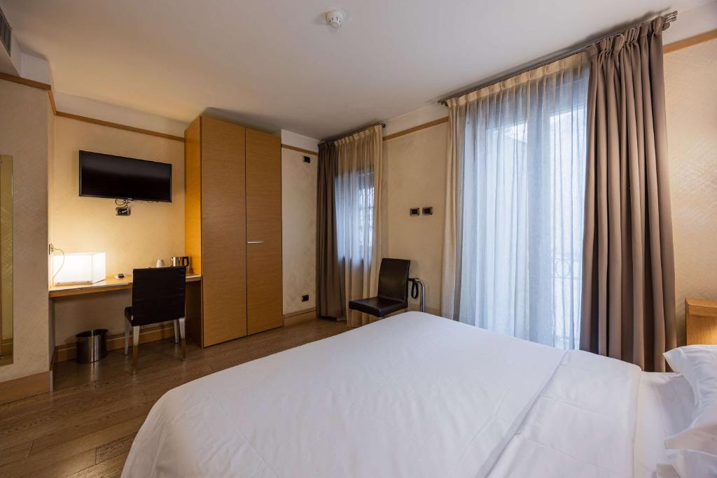 Postel nebo postele na pokoji v ubytování Best Western Hotel Armando