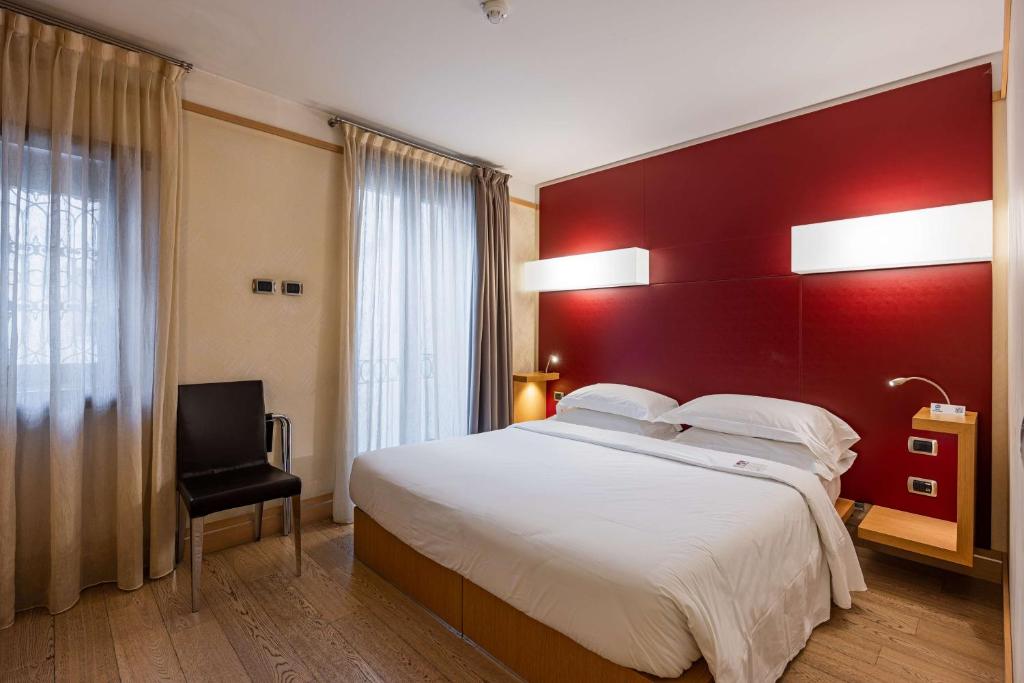 Postel nebo postele na pokoji v ubytování Best Western Hotel Armando