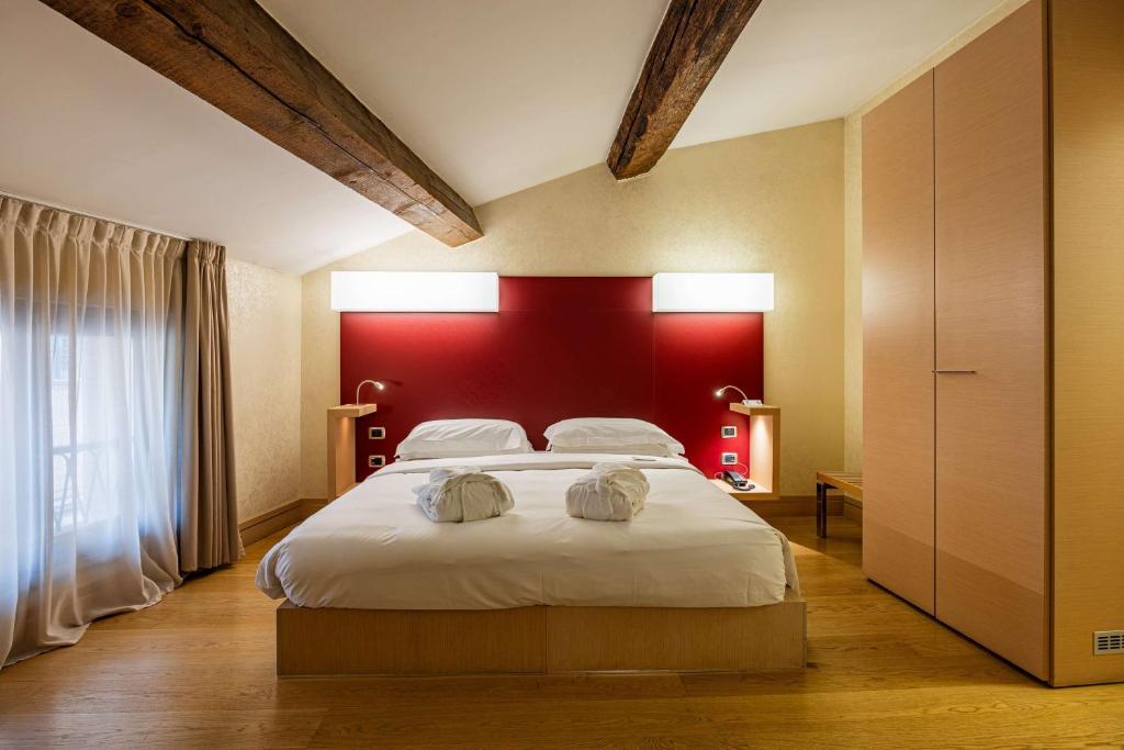 Postel nebo postele na pokoji v ubytování Best Western Hotel Armando