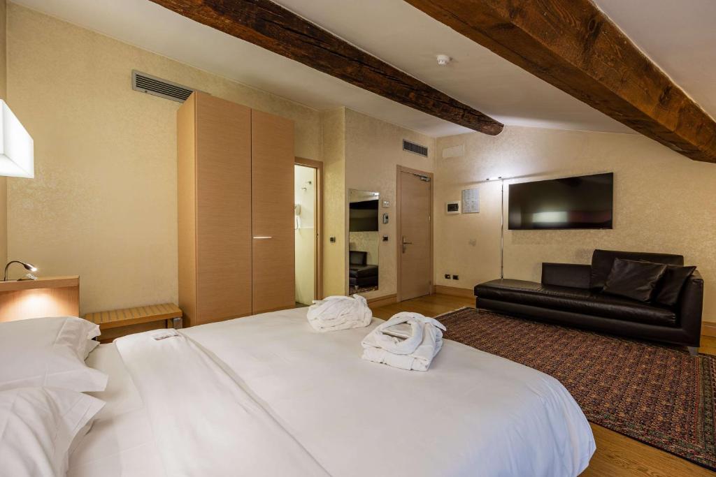 Postel nebo postele na pokoji v ubytování Best Western Hotel Armando