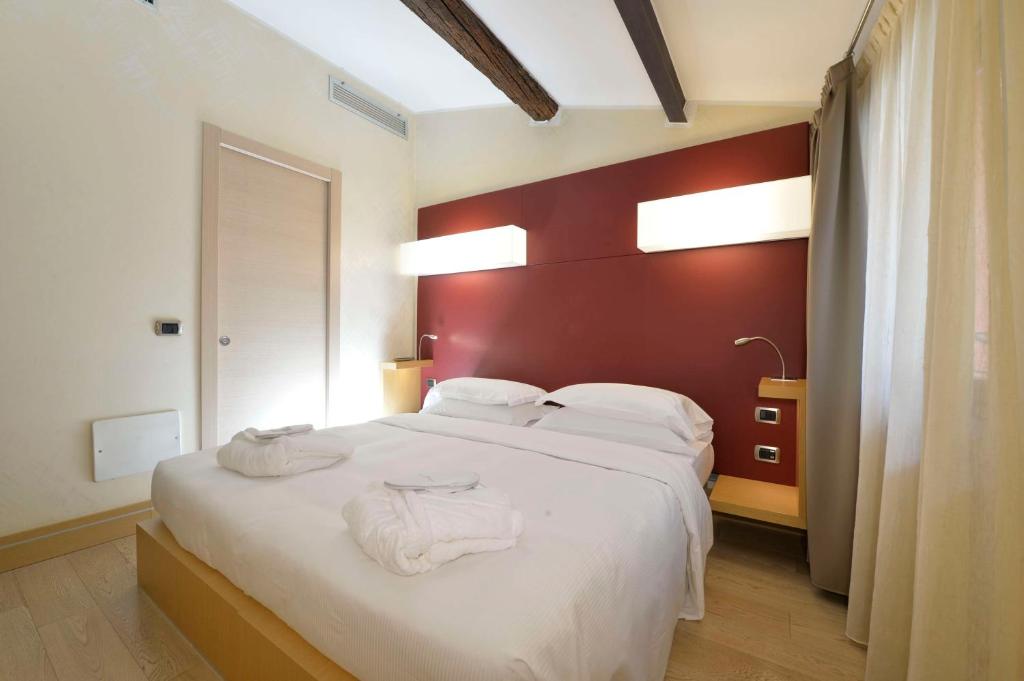 Postel nebo postele na pokoji v ubytování Best Western Hotel Armando