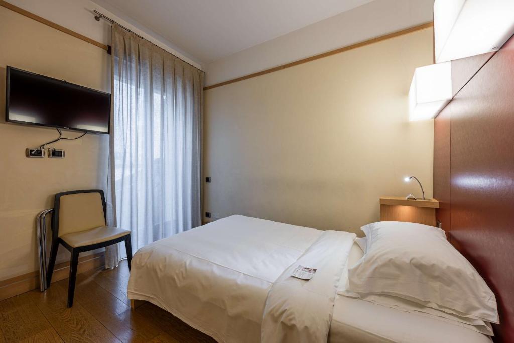 Postel nebo postele na pokoji v ubytování Best Western Hotel Armando