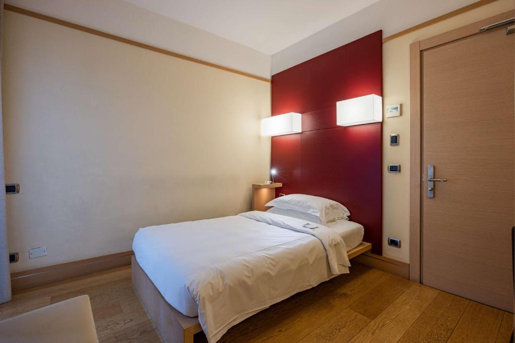 Postel nebo postele na pokoji v ubytování Best Western Hotel Armando