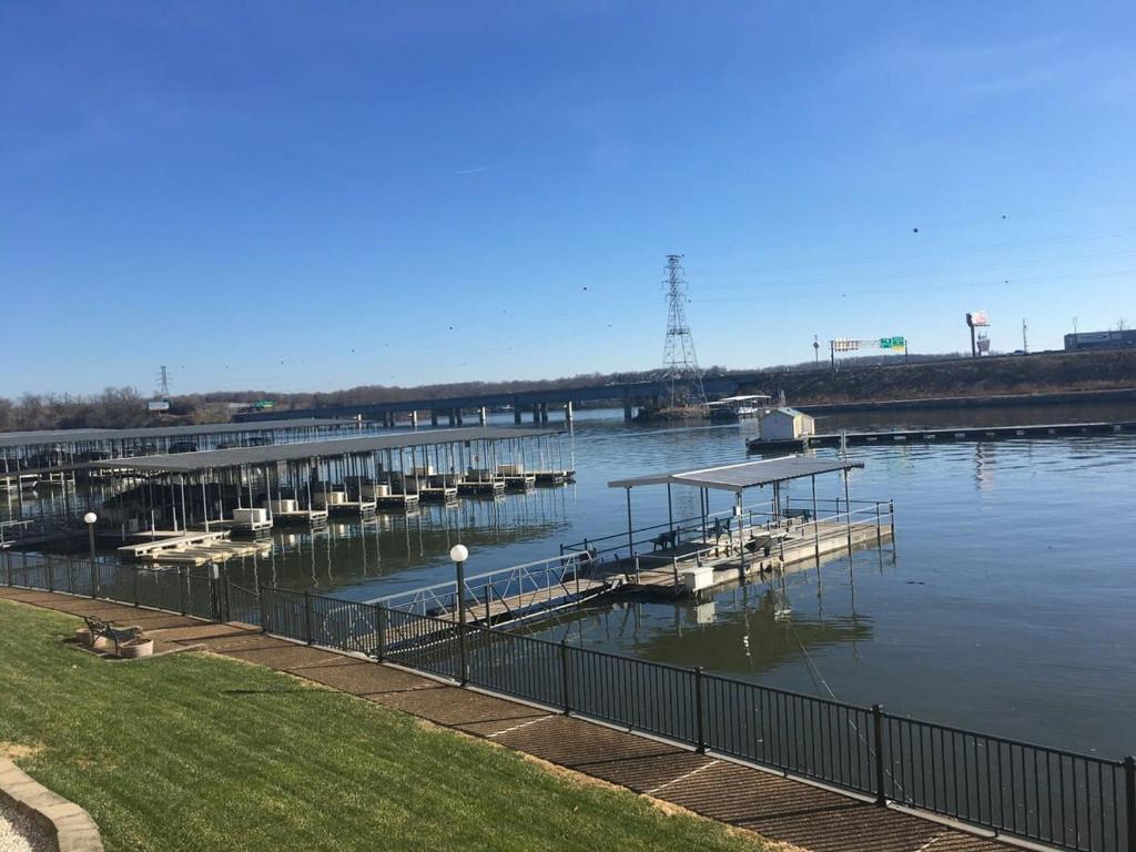 a marina with a bunch of boats in the water at Pool Wi-Fi Hot Tub Lake Views Front Lake of the Ozarks in Osage Beach