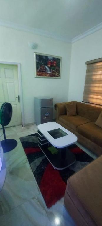a living room with a couch and a coffee table at Nasaplace Venture in Badore