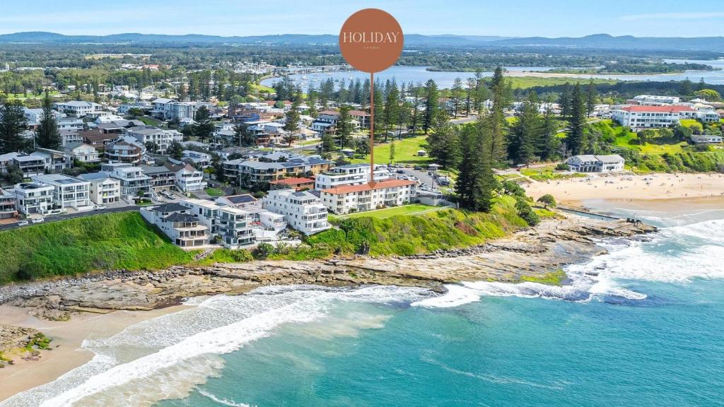 an aerial view of a beach with a hot air balloon at Craigmore Penthouse in Yamba