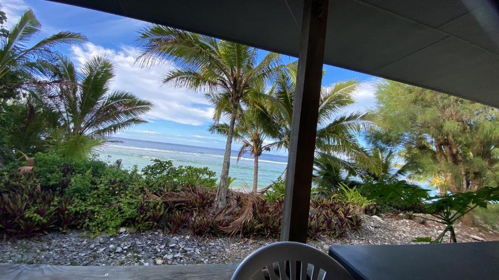 a view of the ocean from a porch at Best Kept Secret in Tupapa in Avarua