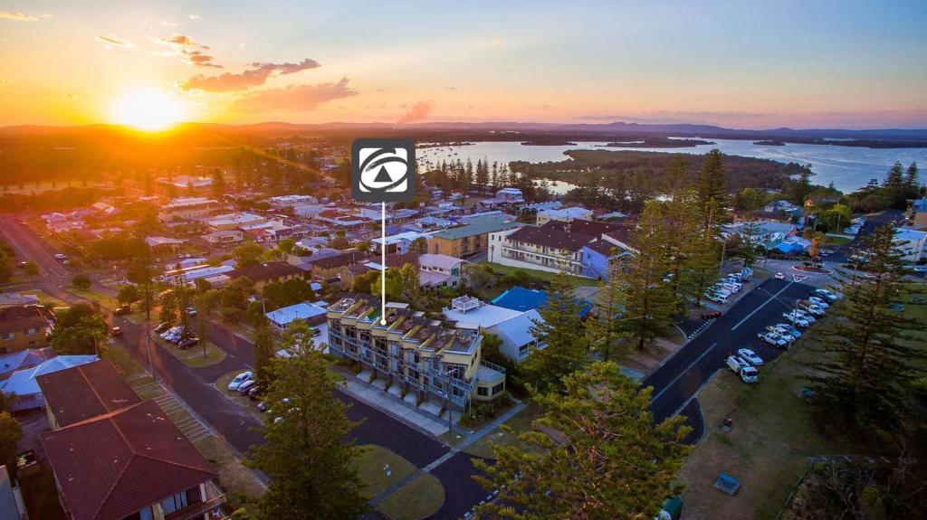 an overhead view of a city with the sunset at Seaspray 5 in Yamba