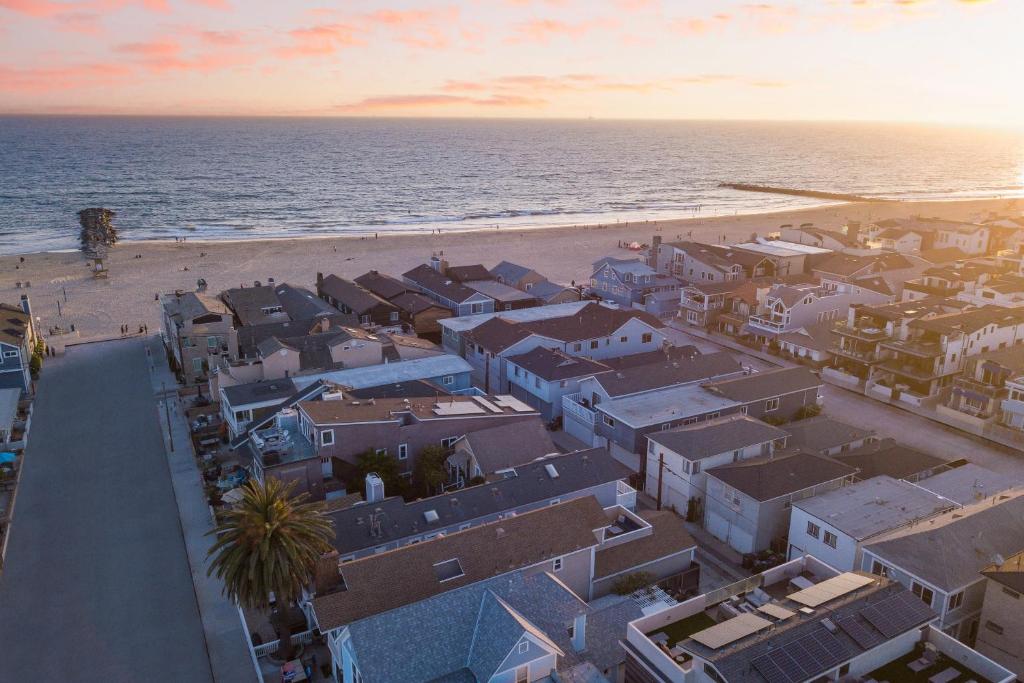 an aerial view of a beach with houses and the ocean at Surfrider II by AvantStay Walk to the Beach Balcony in Newport Beach