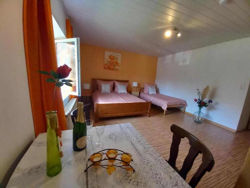 a living room with a table and a couch at Holiday home in Saint Quirin with garden in Saint-Quirin