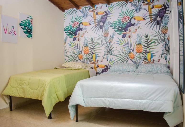 Postel nebo postele na pokoji v ubytování Hostal Pura Vida la 70