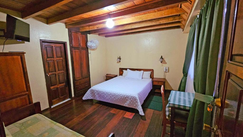 Postel nebo postele na pokoji v ubytování Hostería Finca El Pigual