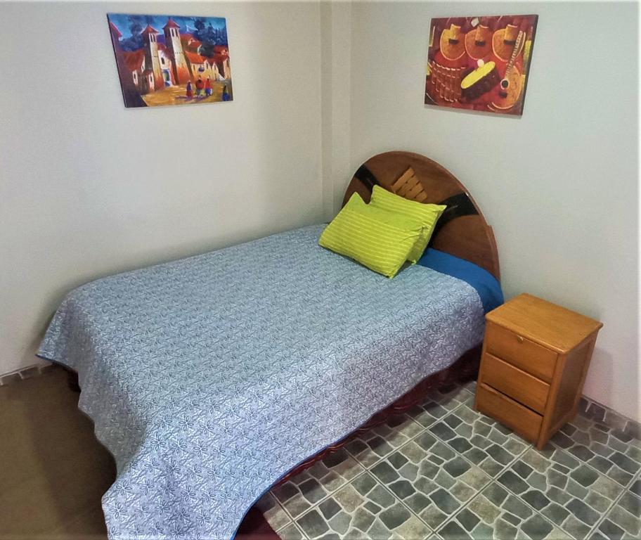 Ένα ή περισσότερα κρεβάτια σε δωμάτιο στο Carlos Guest House 1 Cusco